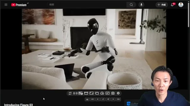 Figure 03ロボットがかがみ込んで両手で物体を持ち上げ、慎重に運んでいる場面。手のひら部分にカメラが確認できる。