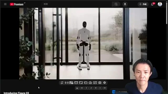 Figure 03ロボットが壁際にある充電ステーションに接続され、充電中の様子。日常的なメンテナンスの容易さを示唆している。